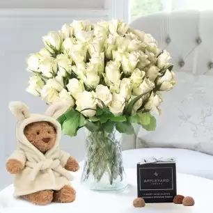 50 White Roses, Jellycat Bartholomew Bear Bathrobe (26cm) & 12 Appleyard Truffles