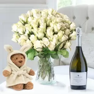 50 White Roses, Jellycat Bartholomew Bear Bathrobe (26cm) & Appleyard Prosecco (75cl)
